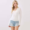 Fitted double layer V-neck long sleeve top in soft white, perfect for layering with denim, ideal for Long Island boutique fashion.