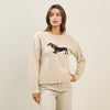 Cozy beige Bow Dog Sweater features a playful dachshund design with a red bow, perfect for stylish Long Island boutique fashion.