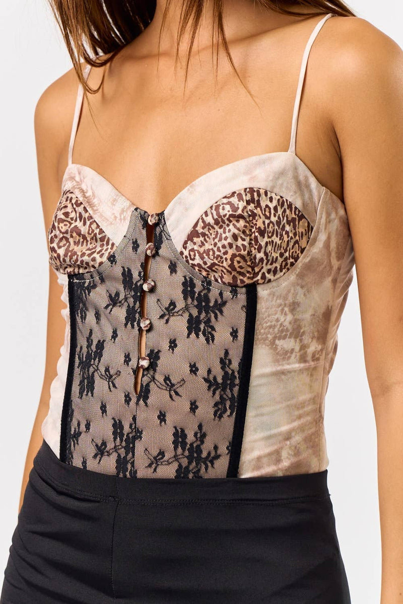 The animal mixed bustier bodysuit features a unique blend of leopard print and delicate floral lace, perfect for Long Island boutique fashion.