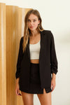 Chic black 3/4 ruched sleeve blazer with a tailored fit, perfect for versatile layering in Long Island boutique fashion.
