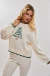 Cozy oversized cream sweater featuring festive Christmas tree stitching and contrasting green trim, perfect for Long Island boutique fashion.