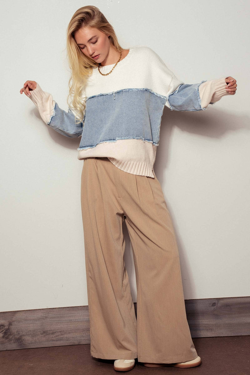 Colorblock distressed denim patchwork knit sweater featuring pastel hues, a relaxed fit, and frayed edges, ideal for Long Island boutique fashion.