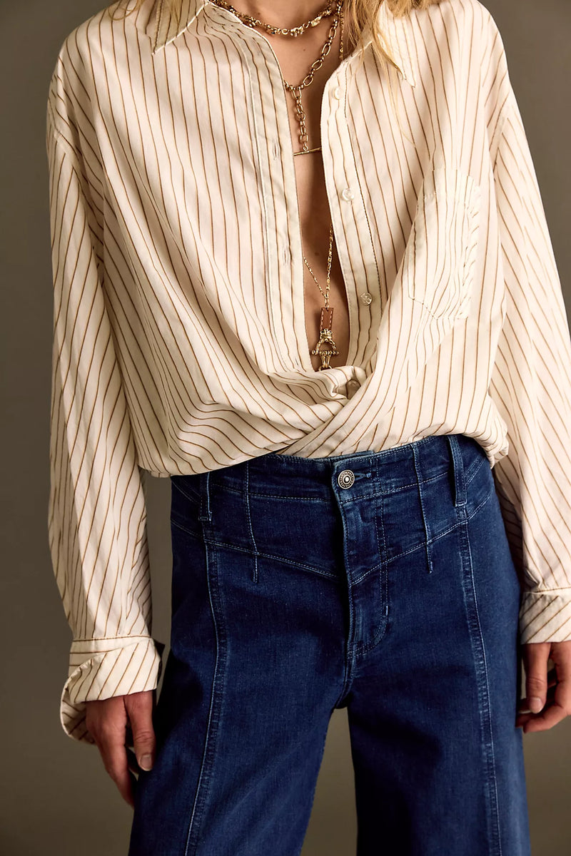 Wide-leg denim jeans in a deep blue wash, featuring a high waist and classic five-pocket styling, ideal for Long Island boutique fashion.