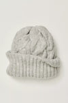Light gray knitted beanie with a braided cable design and a snug, ribbed cuff, perfect for cozying up this season in Long Island boutique fashion.