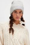 Cozy grey ribbed beanie with a relaxed fit, perfect for chilly weather in Long Island boutique fashion.