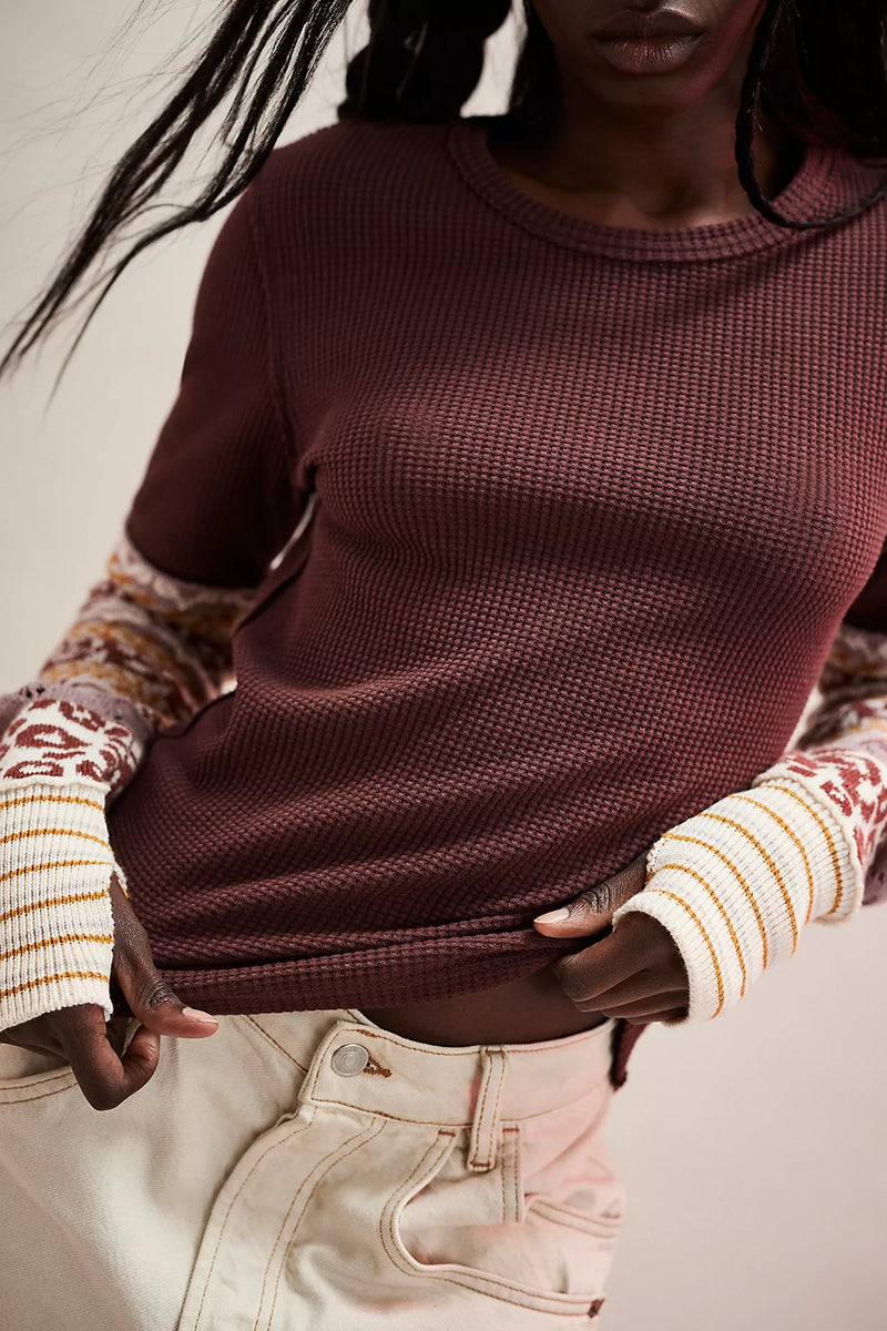 Cozy maroon long-sleeve top with textured body and patterned cuff details, perfect for layering in Long Island boutique fashion.