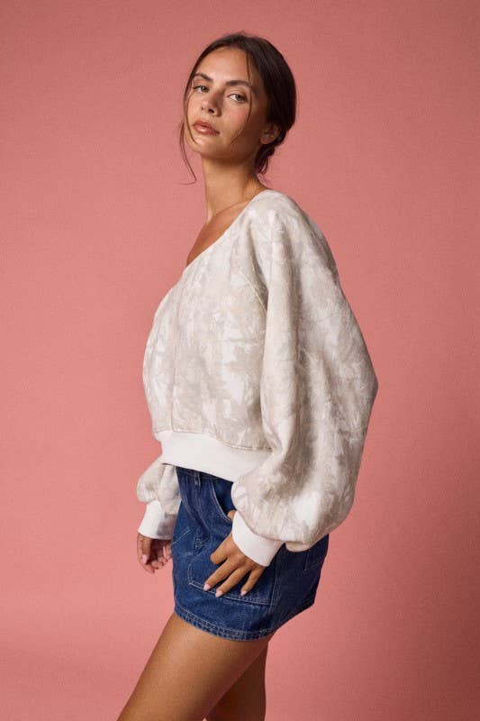 Camo print off-shoulder long sleeve top with billowy sleeves and a relaxed fit, ideal for stylish Long Island boutique fashion.