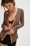 Leopard print cardigan in earthy tones with button-down front and long sleeves, perfect for Long Island boutique fashion.