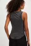 Model wearing Free People Jamie Tank Top in black — ribbed cotton design with overall-inspired buckle straps, available at TandyWear Boutique in Commack, NY. back view