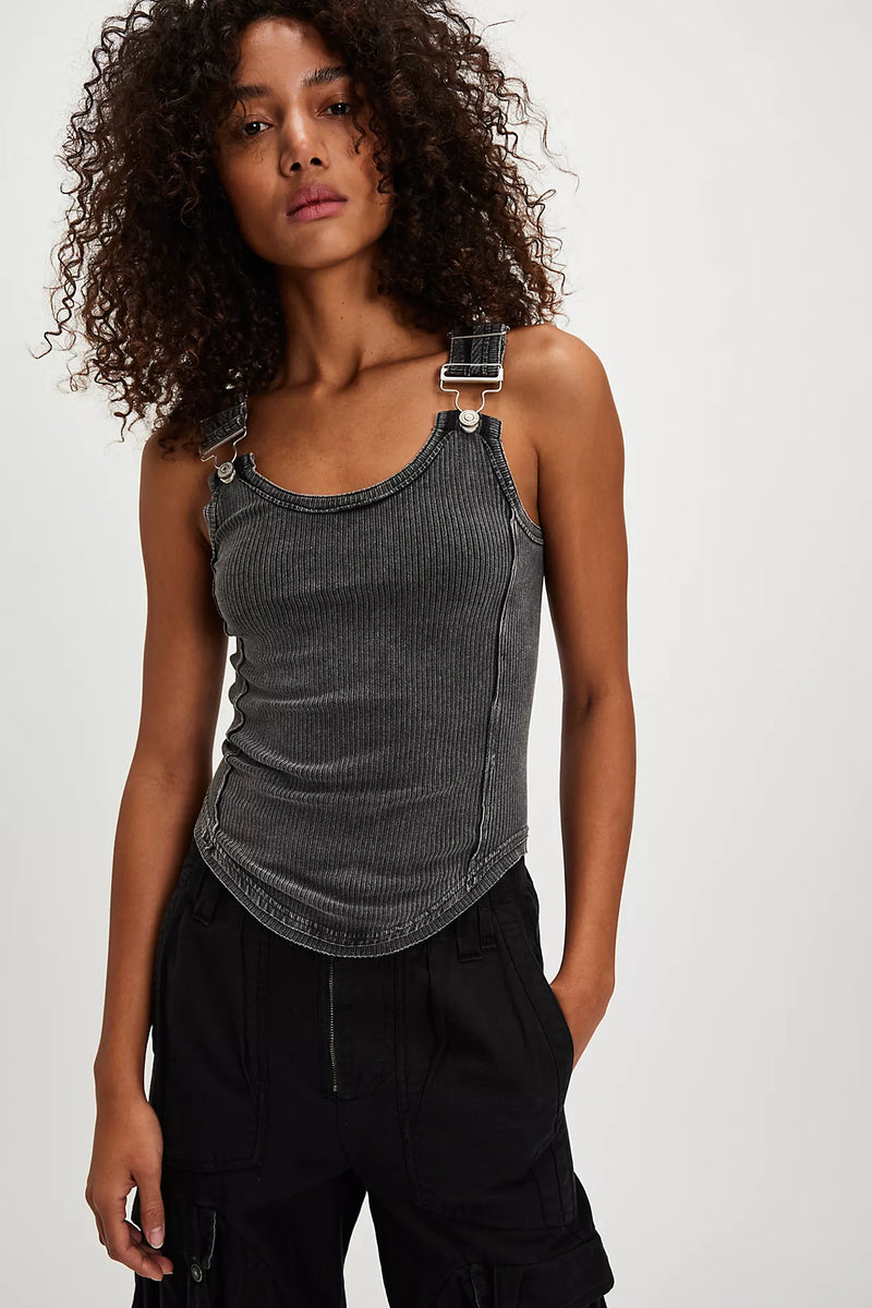 Model wearing Free People Jamie Tank Top in black — ribbed cotton design with overall-inspired buckle straps, available at TandyWear Boutique in Commack, NY. front view 