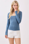 Long sleeve double layer top in a soft blue hue, featuring a square neckline and fitted silhouette for a stylish addition to Long Island boutique fashion.