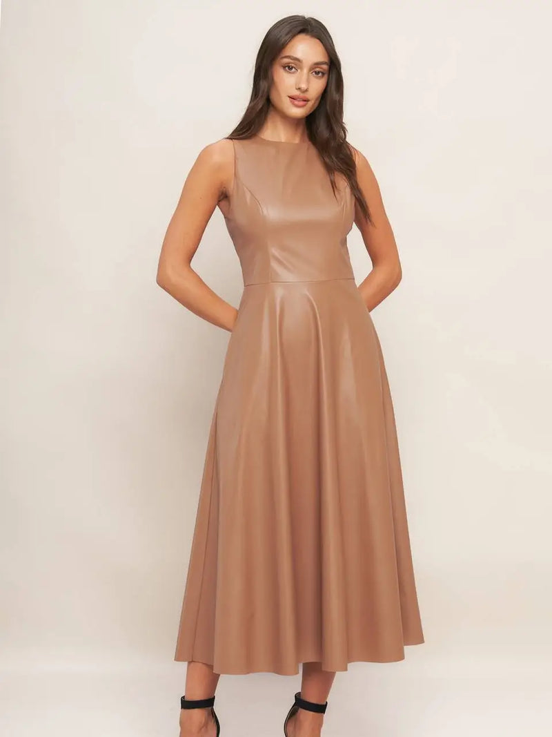 Sleek faux leather midi dress in a warm taupe, featuring a fitted bodice and flared skirt, perfect for Long Island boutique fashion.