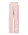 Relaxed-fit, light pink Alex pants featuring a comfortable elastic waistband and playful white graphic details, perfect for Long Island boutique fashion.