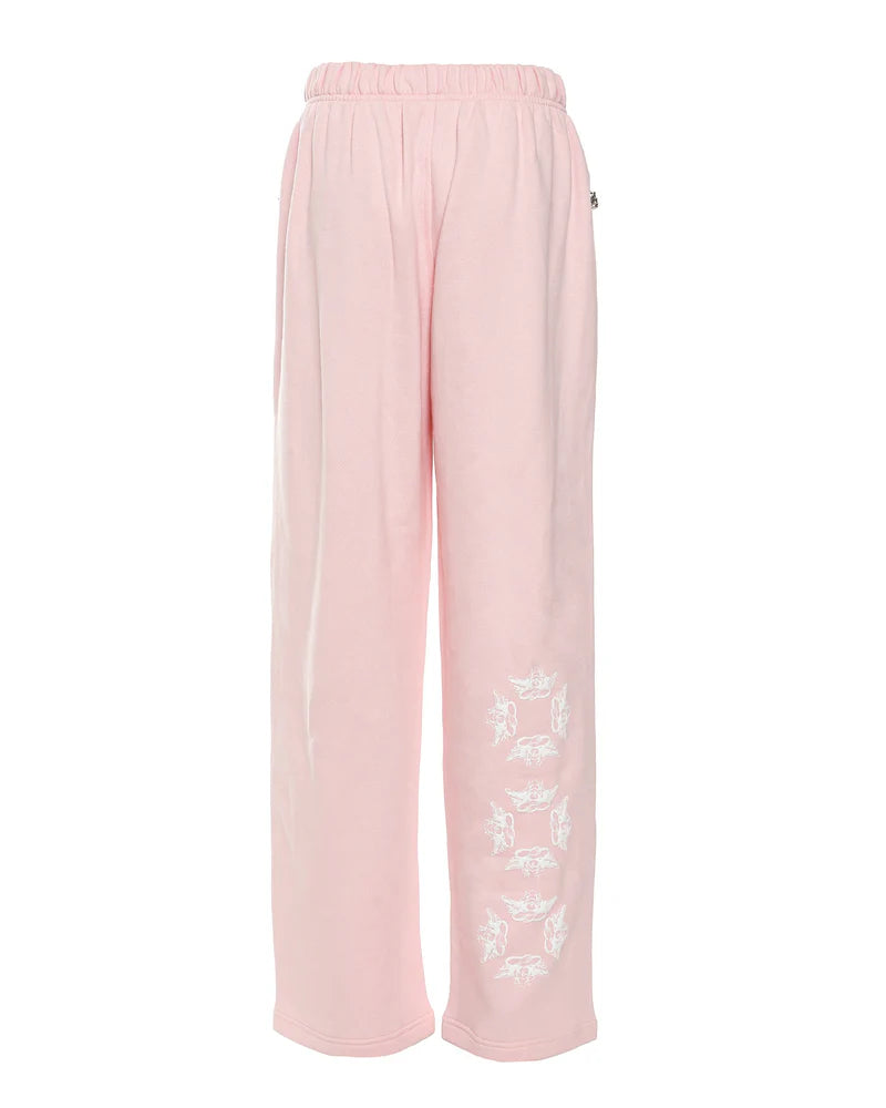 Relaxed-fit, light pink Alex pants featuring a comfortable elastic waistband and playful white graphic details, perfect for Long Island boutique fashion.