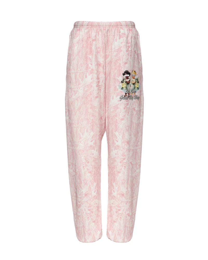 Light pink, relaxed-fit Kimmy pants featuring a playful print and embroidered details, perfect for casual days in Long Island boutique fashion.
