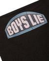 Black tube top featuring a bold "BOYS LIE" graphic with rhinestone accents, perfect for trendy looks at a Long Island women's boutique.