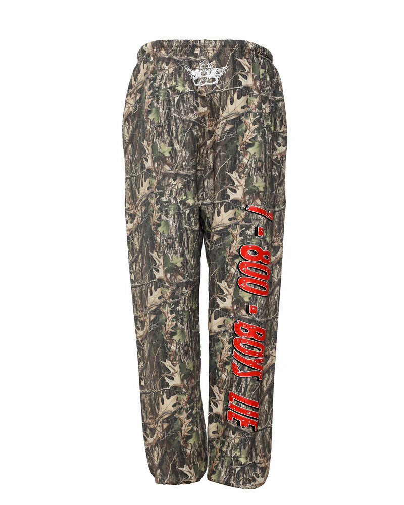 Camo-print pants featuring an elastic waistband and bold "1-800 BOYS LIE" text, perfect for trendy Long Island boutique fashion.