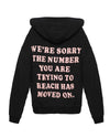 Soft black racer hoodie featuring bold pink lettering on the back, delivering a playful message, perfect for Long Island boutique fashion.