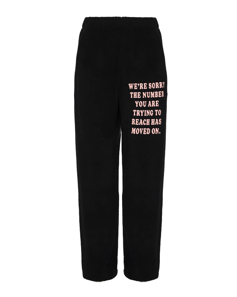 Black mac slim pants featuring a relaxed fit and playful pink text, perfect for casual wear from a Long Island women's boutique.