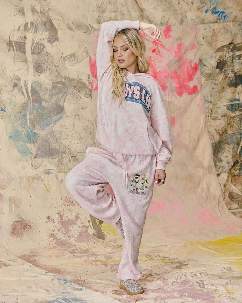 Soft pink Kimmy pants featuring a relaxed fit, playful cartoon graphics, and a drawstring waist, embodying Long Island boutique fashion.
