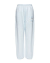 Light blue, relaxed-fit Kimmy pants with an elastic waistband and subtle logo detail, perfect for lounging in Long Island boutique fashion.