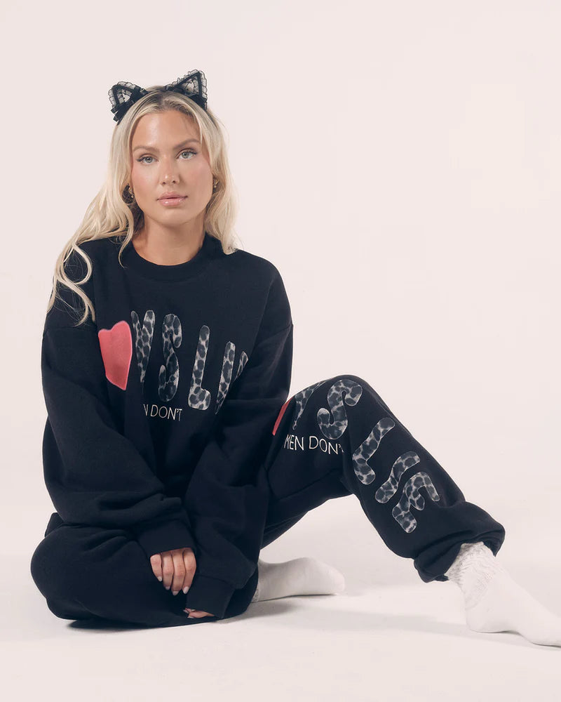Black crewneck sweatshirt featuring bold leopard print lettering and a red heart, perfect for Long Island boutique fashion lovers.