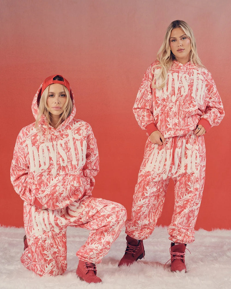 Red camo hoodie featuring bold "boys lie" graphics, paired with matching joggers, perfect for trendy Long Island boutique fashion.