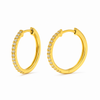 Gold hoop earrings with small diamonds on a white background