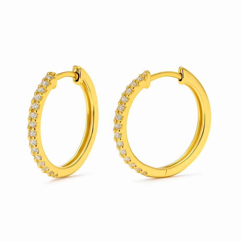 Gold hoop earrings with small diamonds on a white background