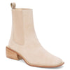 Beige suede ankle boots with a sleek design and a low stacked heel, perfect for adding a touch of elegance to any Long Island boutique fashion outfit.