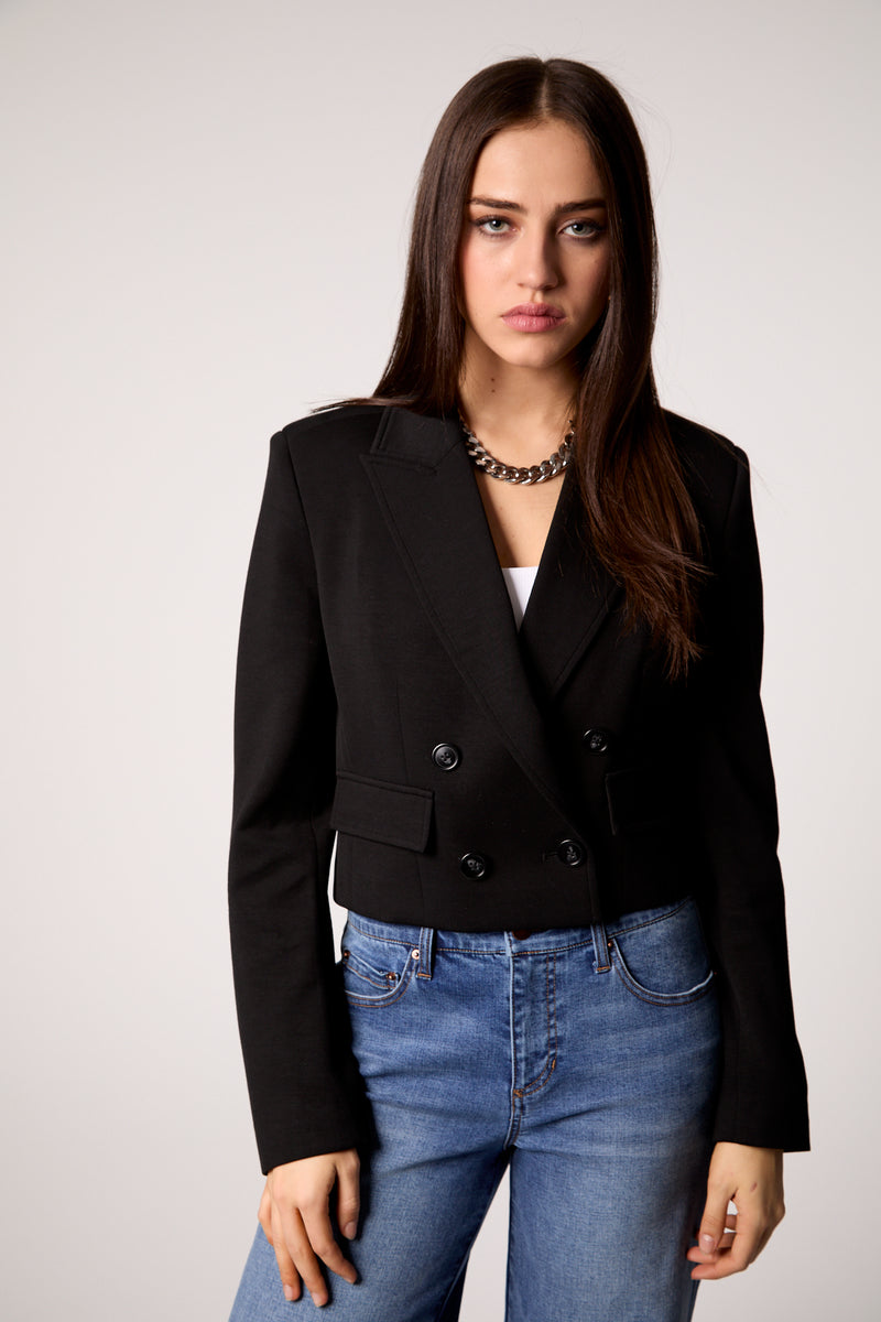 Cropped black double-breasted blazer with a tailored fit, styled for a chic look in Long Island boutique fashion.