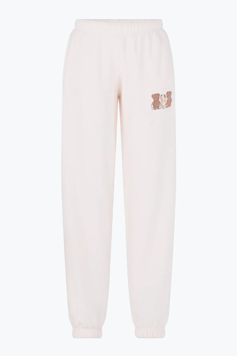 Soft cream joggers featuring an adorable graphic of three bears, perfect for relaxed looks in Long Island boutique fashion.