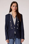 Chic blue denim blazer with a trendy removable gray hoodie insert and silver button details, perfect for Long Island boutique fashion.