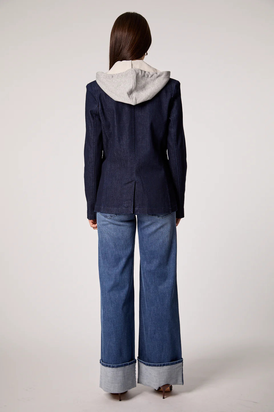 Chic blue denim blazer with a trendy removable gray hoodie insert and silver button details, perfect for Long Island boutique fashion.
