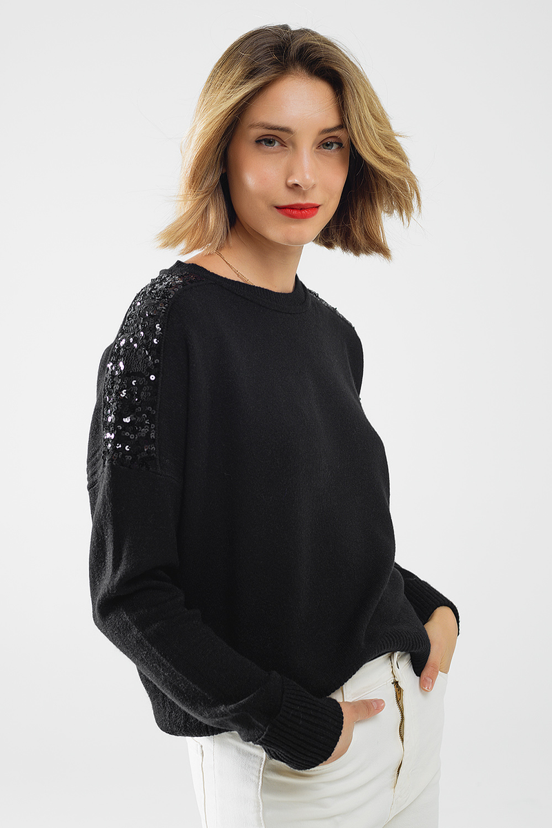Soft black sweater featuring sparkling sequins on the shoulders, perfect for adding flair to your Long Island boutique fashion wardrobe.