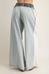 Light blue color block denim drawstring pants featuring a wide-leg fit and a comfortable elastic waistband, perfect for Long Island boutique fashion.