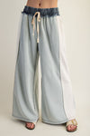 Lightweight color block denim drawstring pants in soft pastel blue with a relaxed fit and frayed waistband, perfect for Long Island boutique fashion.