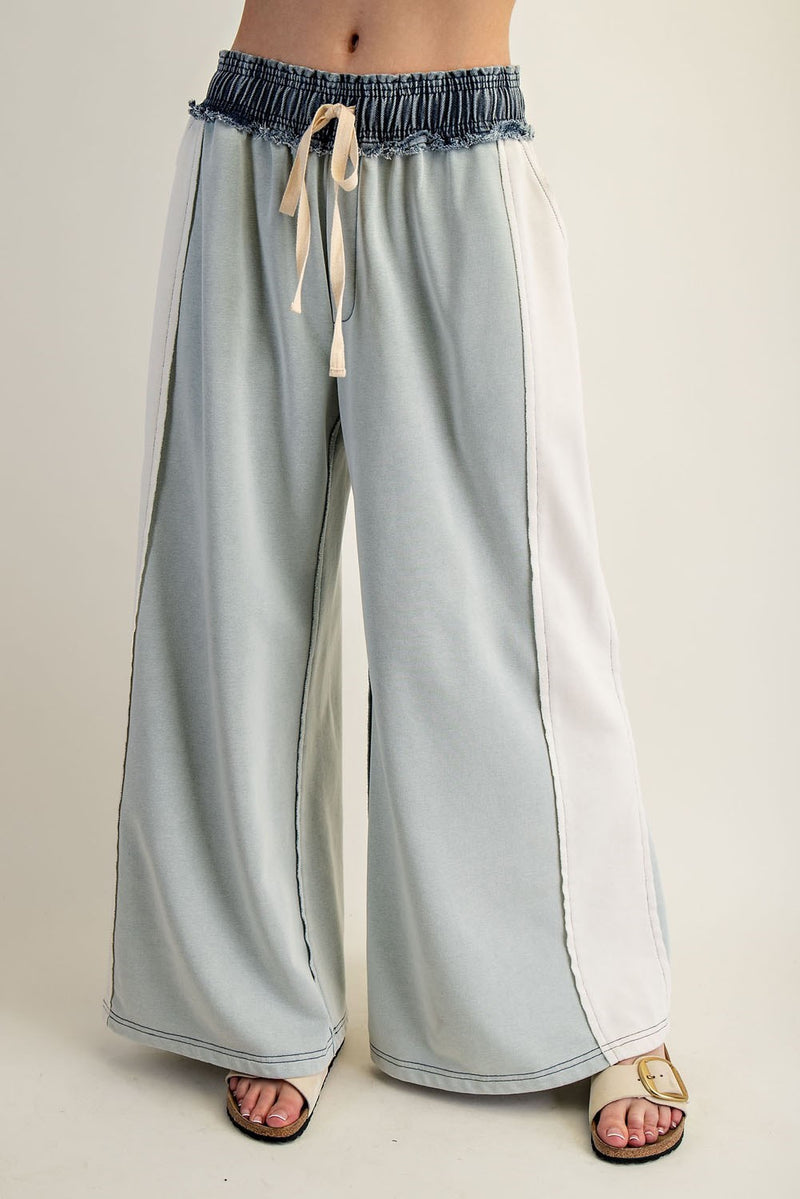Lightweight color block denim drawstring pants in soft pastel blue with a relaxed fit and frayed waistband, perfect for Long Island boutique fashion.
