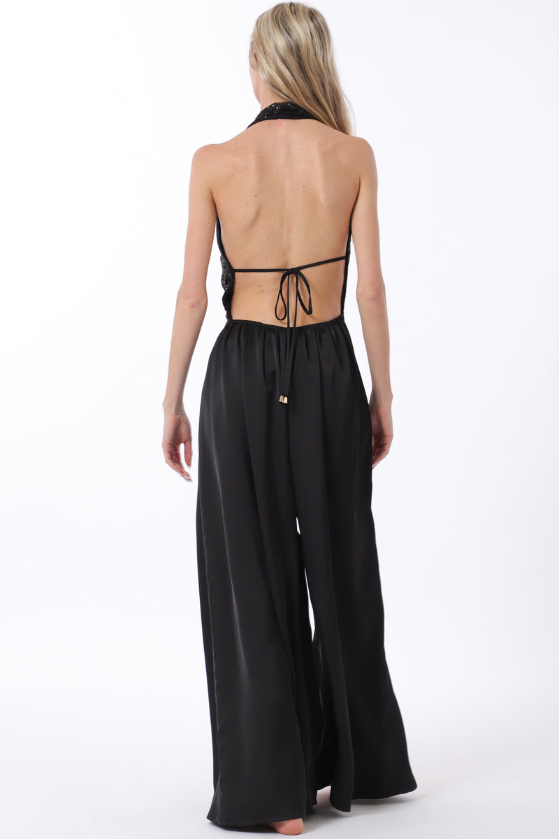 Sleek black cowl neck jumpsuit with a tie-back design, featuring an elastic waist for a flattering fit, perfect for Long Island boutique fashion.