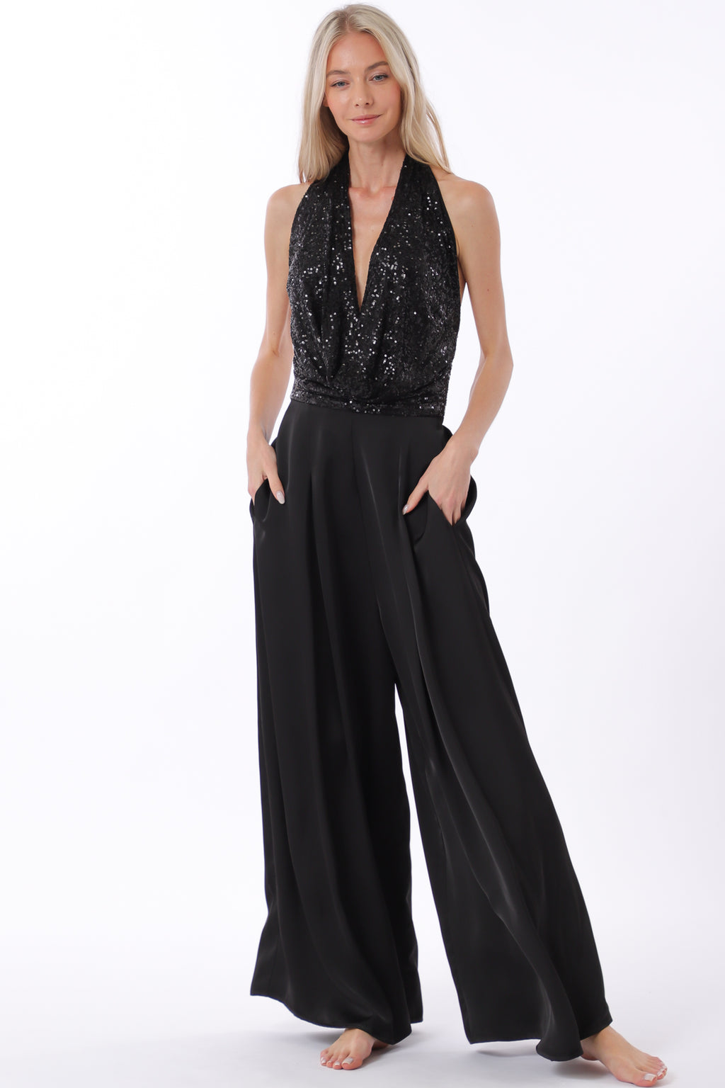 Stylish black jumpsuit featuring a cowl neck and tie back with an elastic bodice, perfect for Long Island boutique fashion.