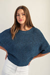 Cropped half dolman sleeve knit sweater in deep blue with textured stitching, perfect for layering in Long Island boutique fashion.