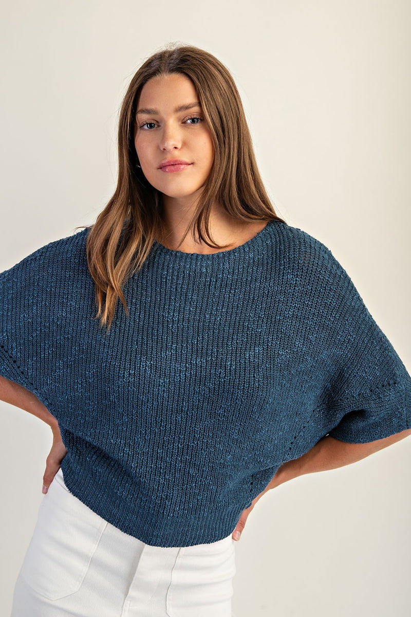 Cropped half dolman sleeve knit sweater in deep blue with textured stitching, perfect for layering in Long Island boutique fashion.