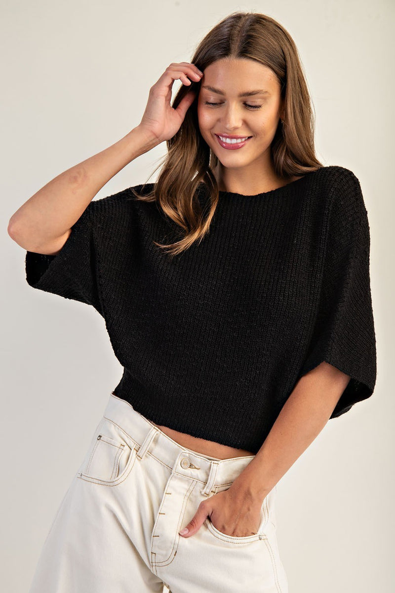 Cropped black half dolman sleeve knit sweater with a relaxed fit, perfect for a stylish look in Long Island boutique fashion.