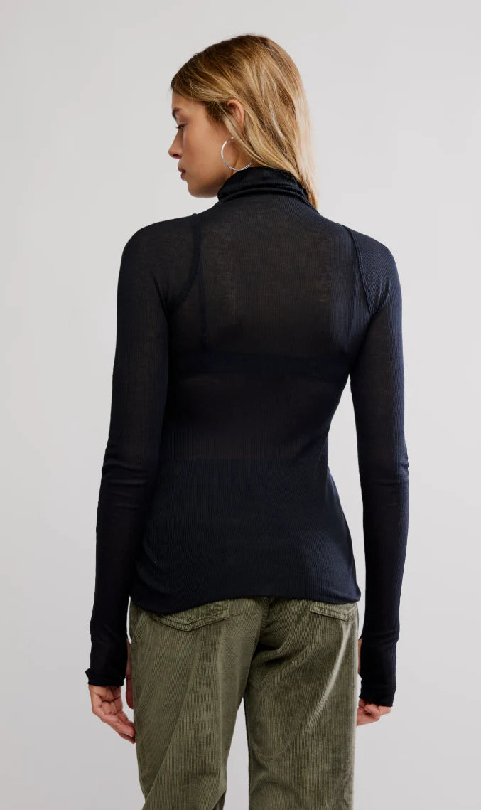 Long sleeve black layering top with a fitted turtleneck design, perfect for pairing with bottoms, ideal for Long Island boutique fashion.