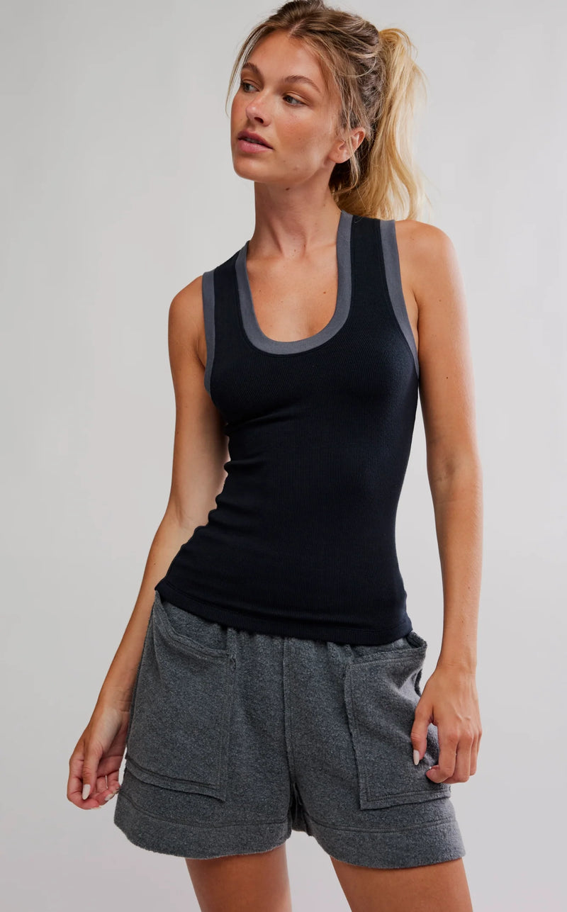 Sleek black tank top with grey trim, featuring a fitted ribbed design ideal for casual wear, perfect for Long Island boutique fashion.
