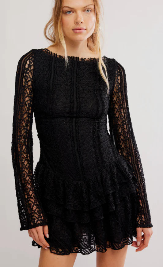 Lace mini dress in black featuring long sleeves, intricate patterns, and a ruffled hem, perfect for Long Island boutique fashion.