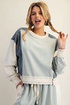 Frayed color block long sleeve pullover in soft blue tones features a relaxed fit and stylish distressed detailing, perfect for Long Island boutique fashion.