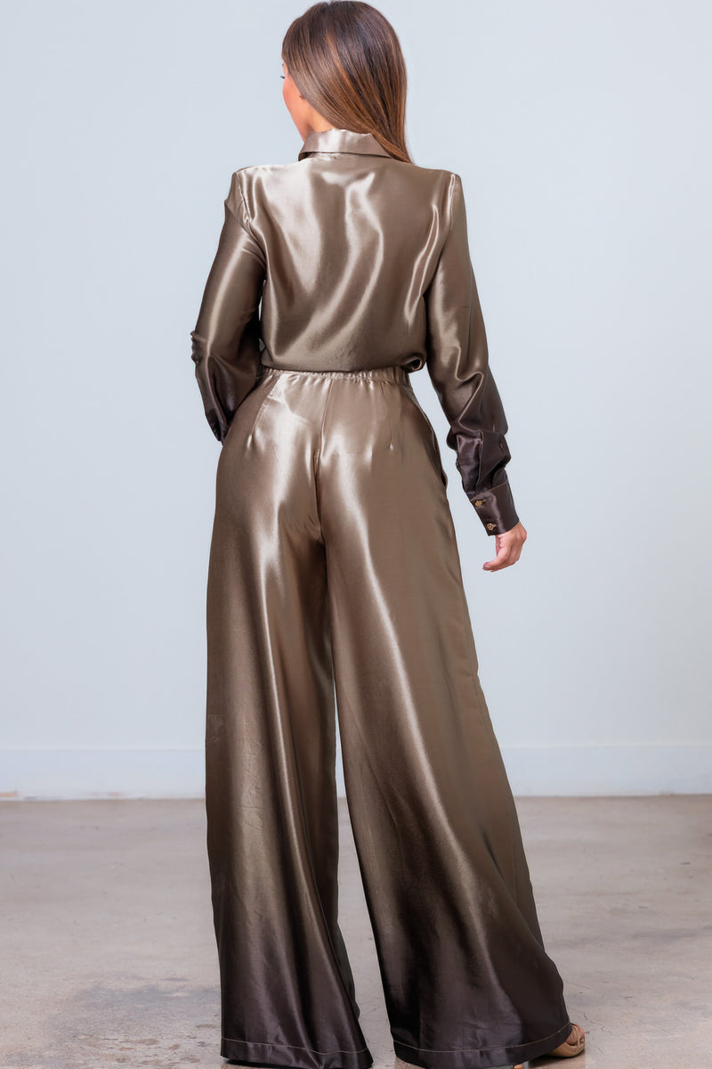 Sleek gradient blouse with long cuff sleeves paired with flowy pants, perfect for a chic look at any Long Island fashion boutique.