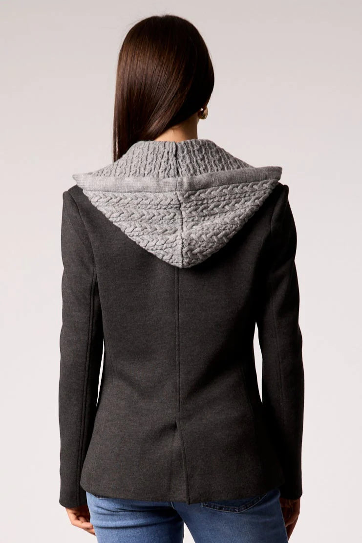 Chic blue cable knit blazer featuring a stylish grey knit hood, perfect for layering in Long Island boutique fashion.