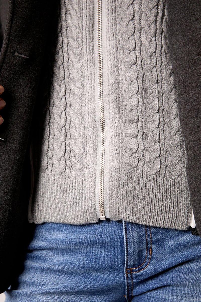 A cozy blue cable knit blazer featuring a soft grey lined interior, perfect for chic layering in Long Island boutique fashion.